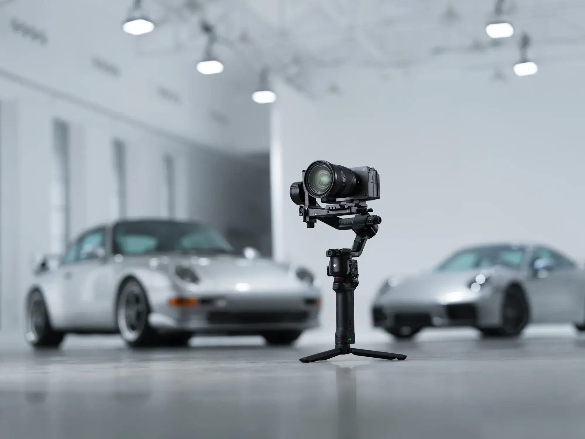 DJI RS 5 with a mirrorless camera in a studio