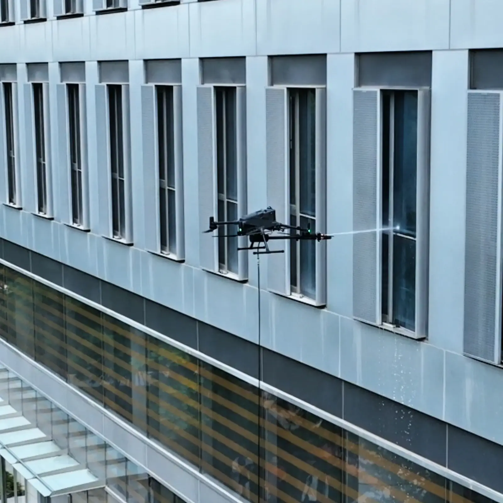 Matrice 400 and HoverWash 3 cleaning windows and facade panels