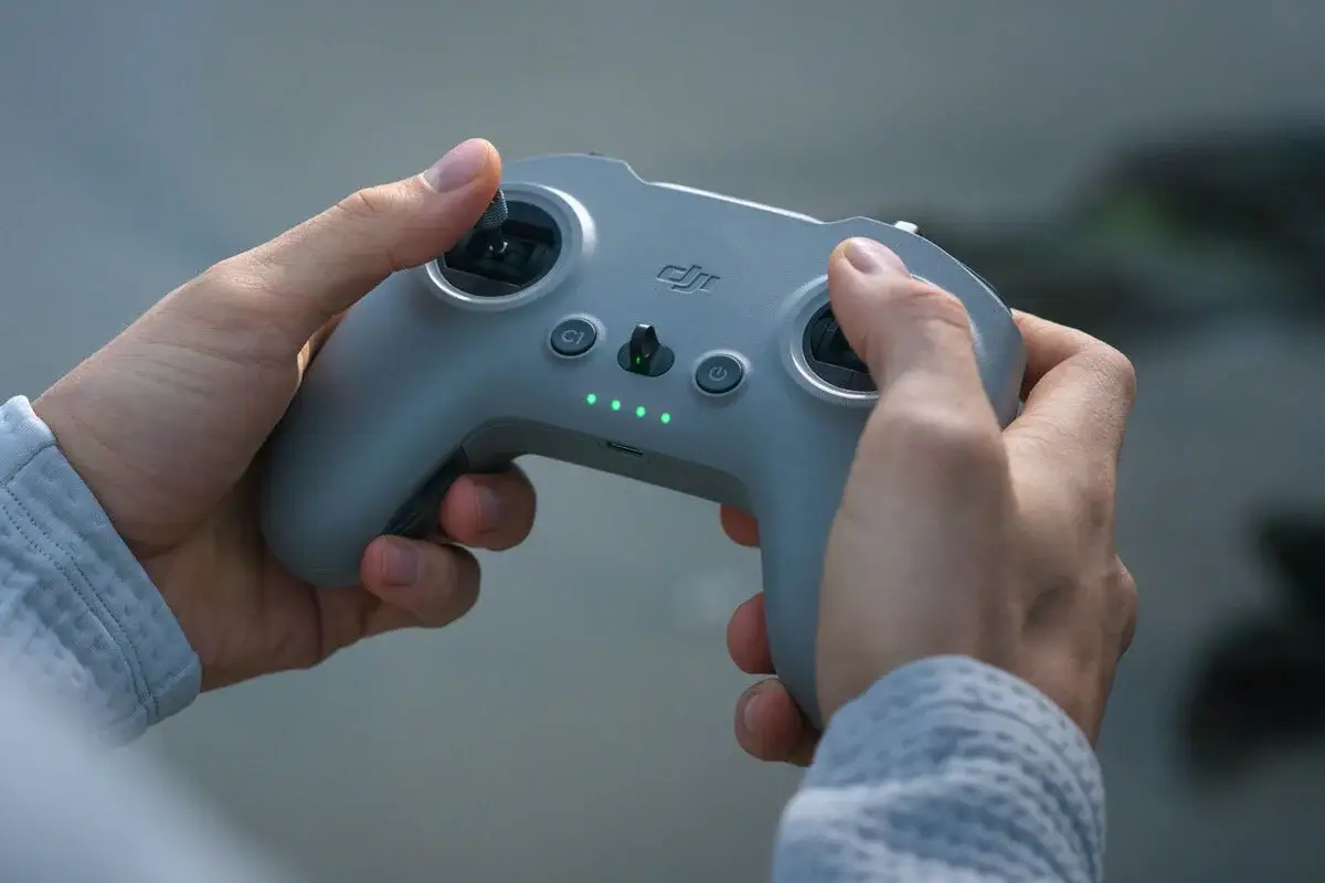DJI FPV Remote Controller 3 held in both hands